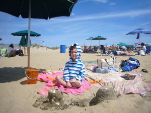 Tyler showing off his first sandcastle!